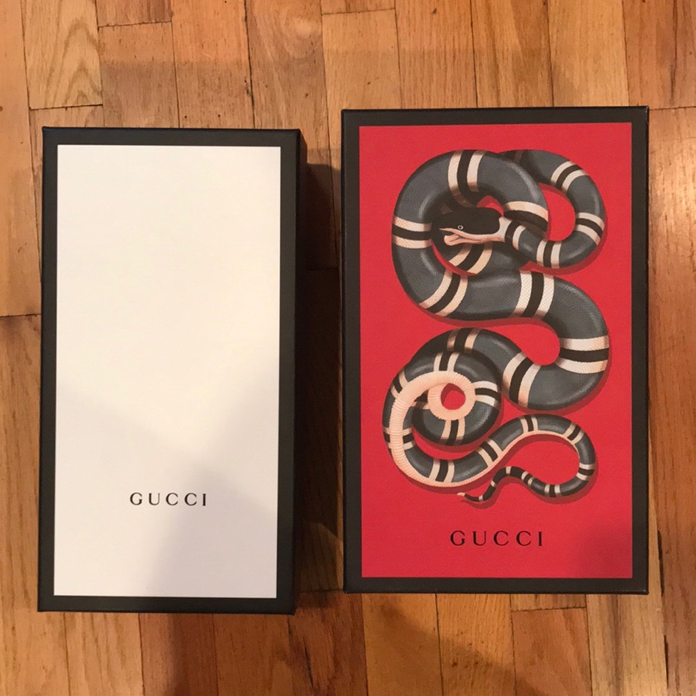 Two Gucci shoe boxes